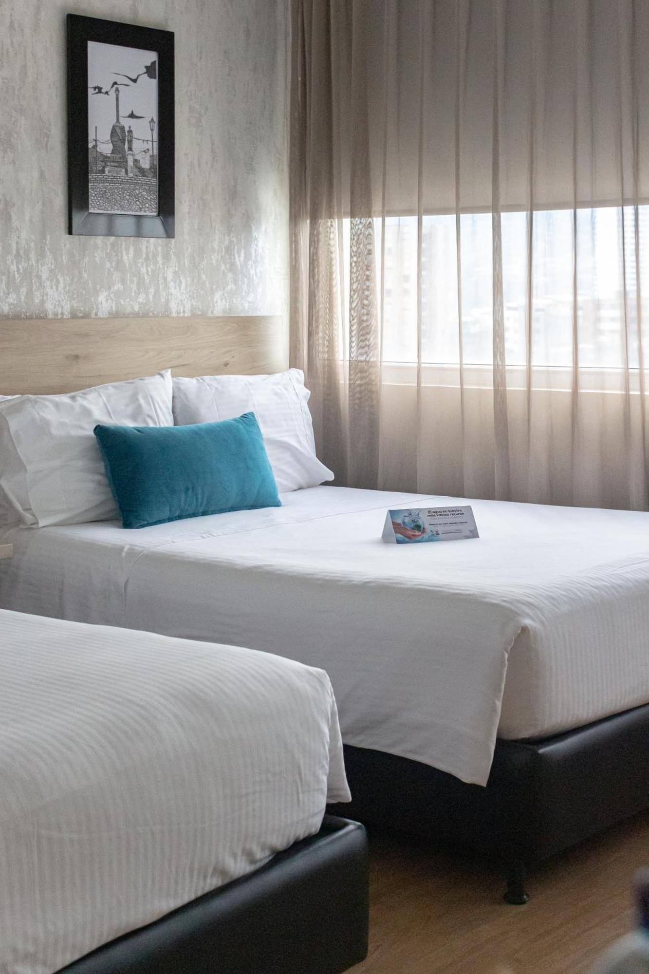 Hotel Casino Internacional Cucuta Exterior photo A bed with a pillow